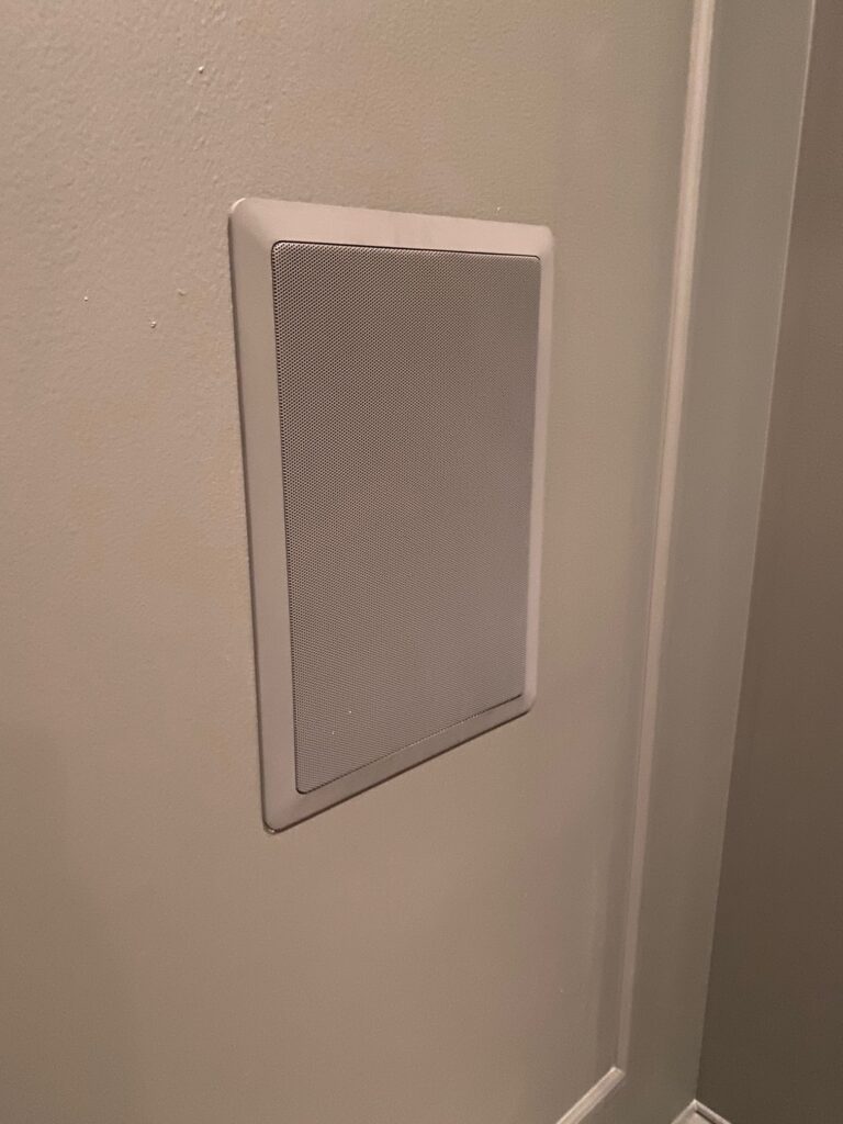 Polk in-wall surround speakers with painted grill