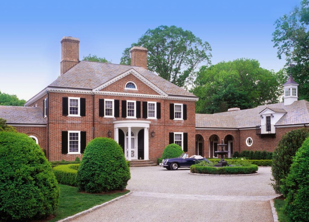A Georgian home with brown gutters 