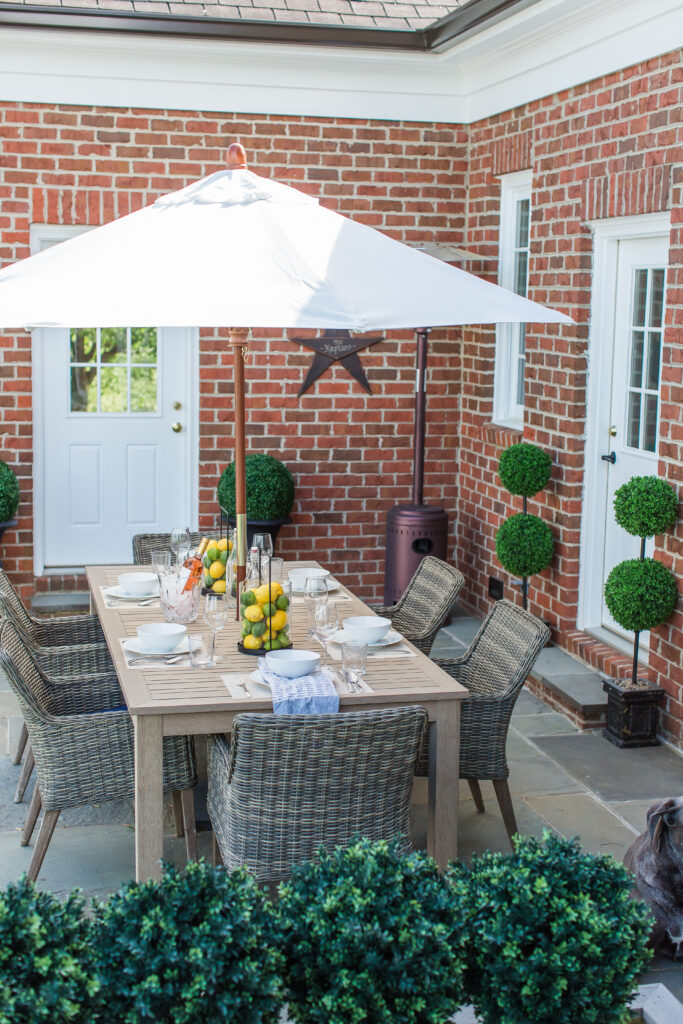 The large scale of this faux teak table works perfectly in our outdoor space!