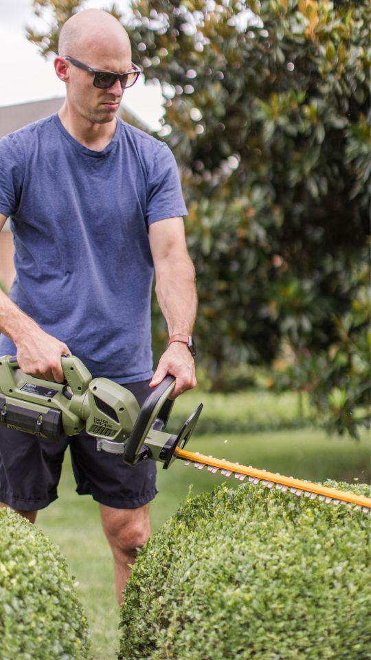 Cutting our front bushes with the Green Machine Hedge Trimmer