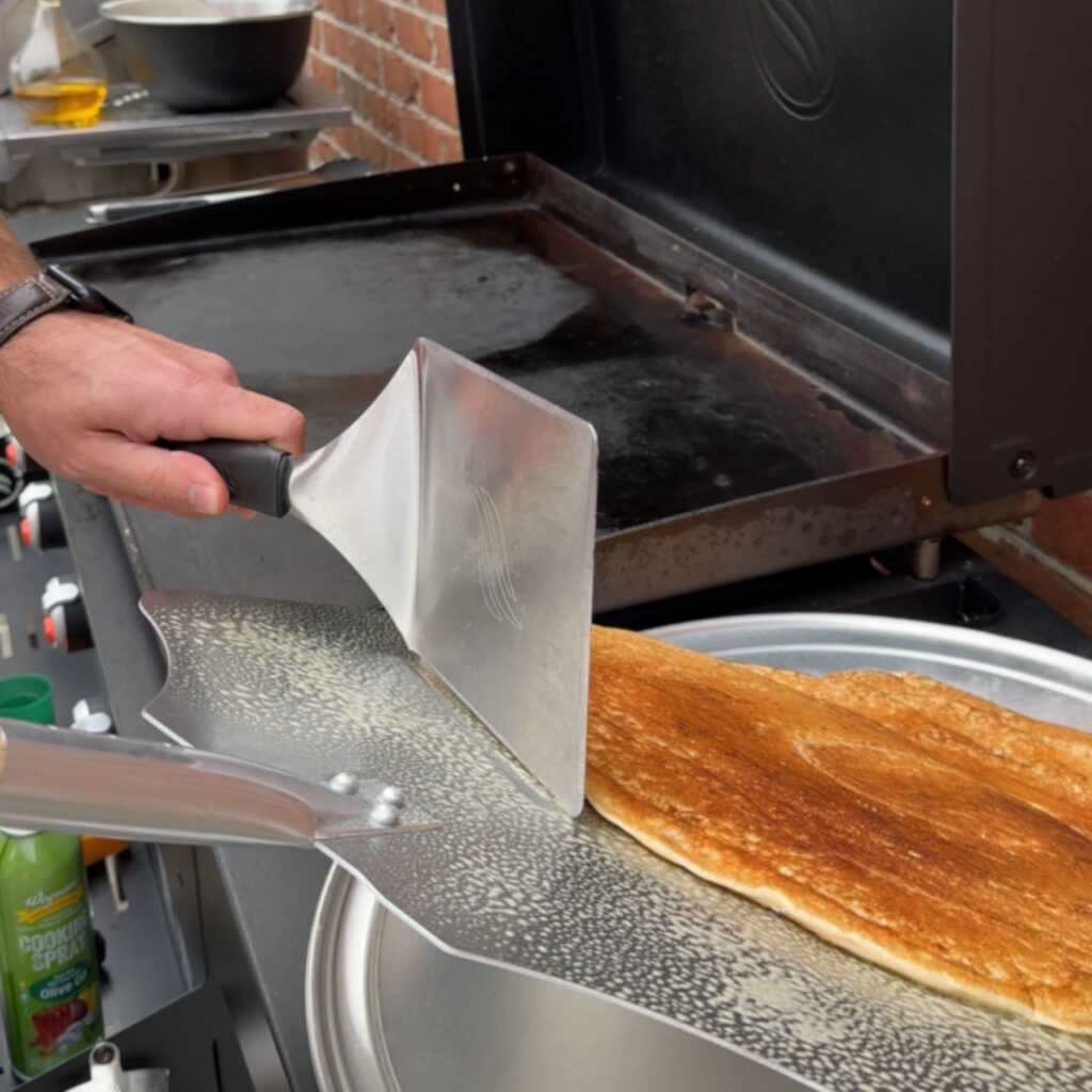 Slide the pancake off of the pizza peel onto the platter