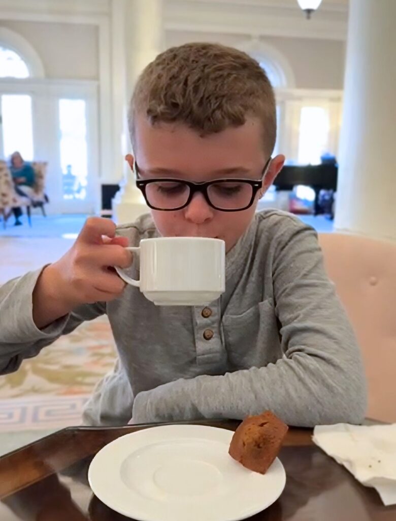 Tristan enjoying Hot Cider at Social Hour in the Lobby
