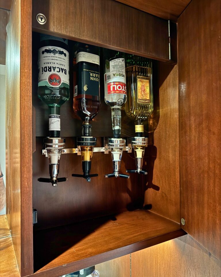 Tucked in the upper cabinet by the bar in our room - an alcohol dispenser!