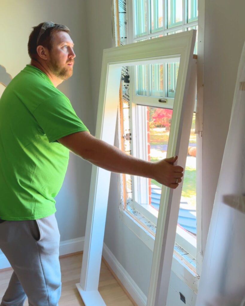 The crew assembled the inside window casing and ensured a tight fit.